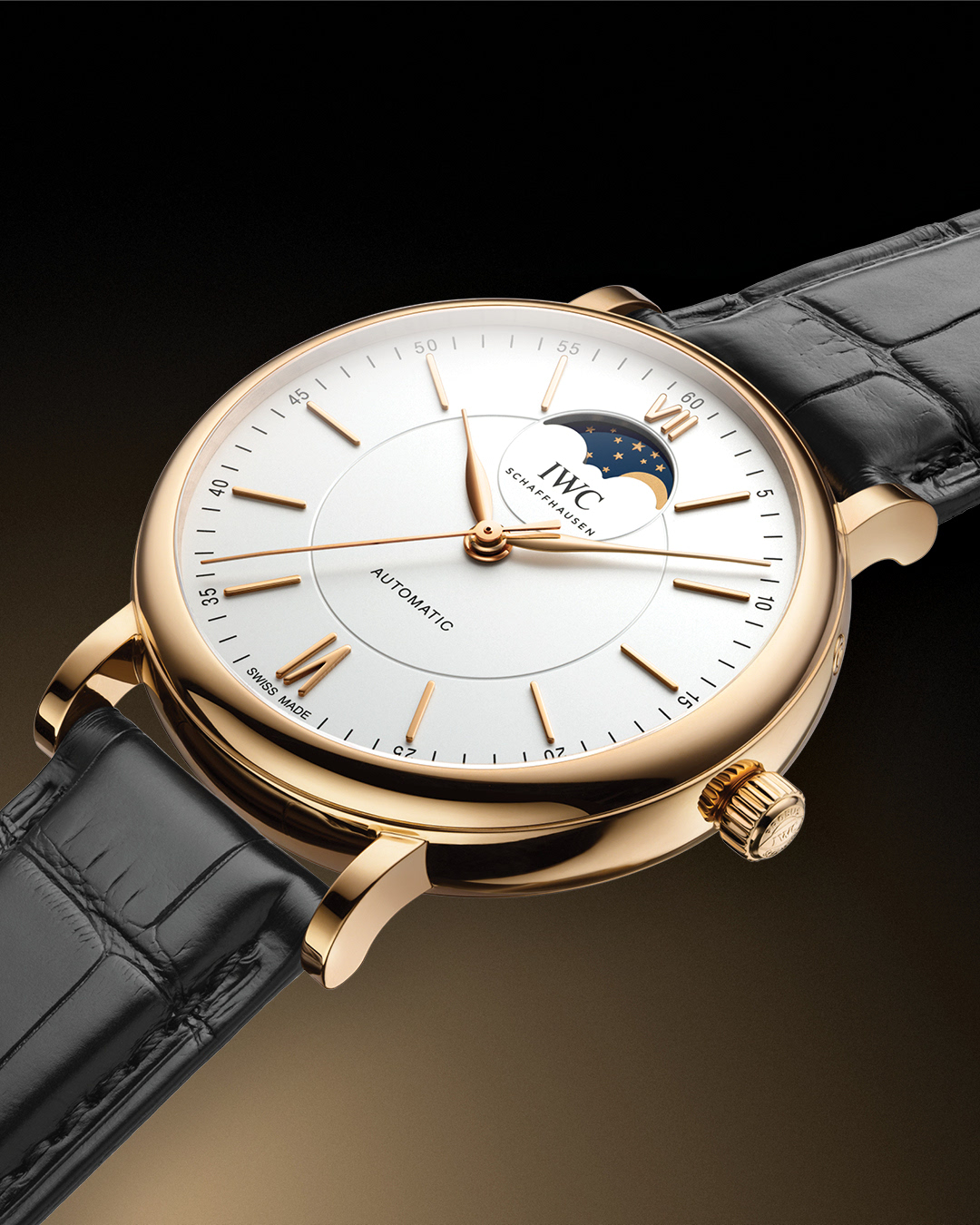 Engineering the night sky. 

The Portofino Automatic Moon Phase combines precise lunar tracking with clean, modern design. A 40mm gold case frames the moon and stars, reflecting function and timeless style.

📸 IW459403
🔗 Link in bio. 

#IWCwatches | #IWCportofino