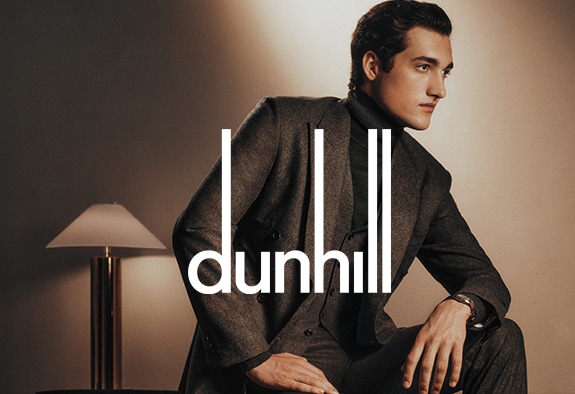 Dunhill logo with a man in a dark grey suit in the background