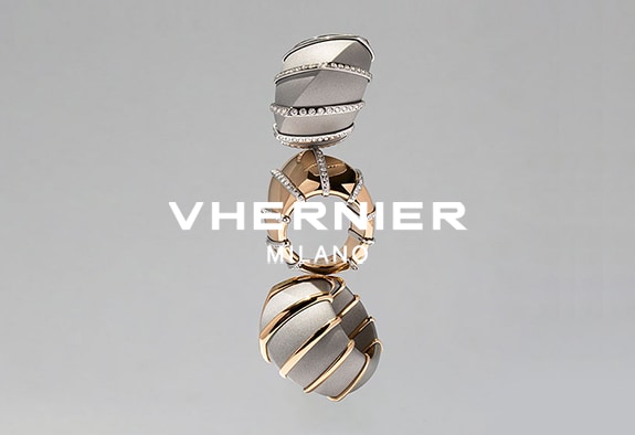 Vhernier logo with 3 rings in the background